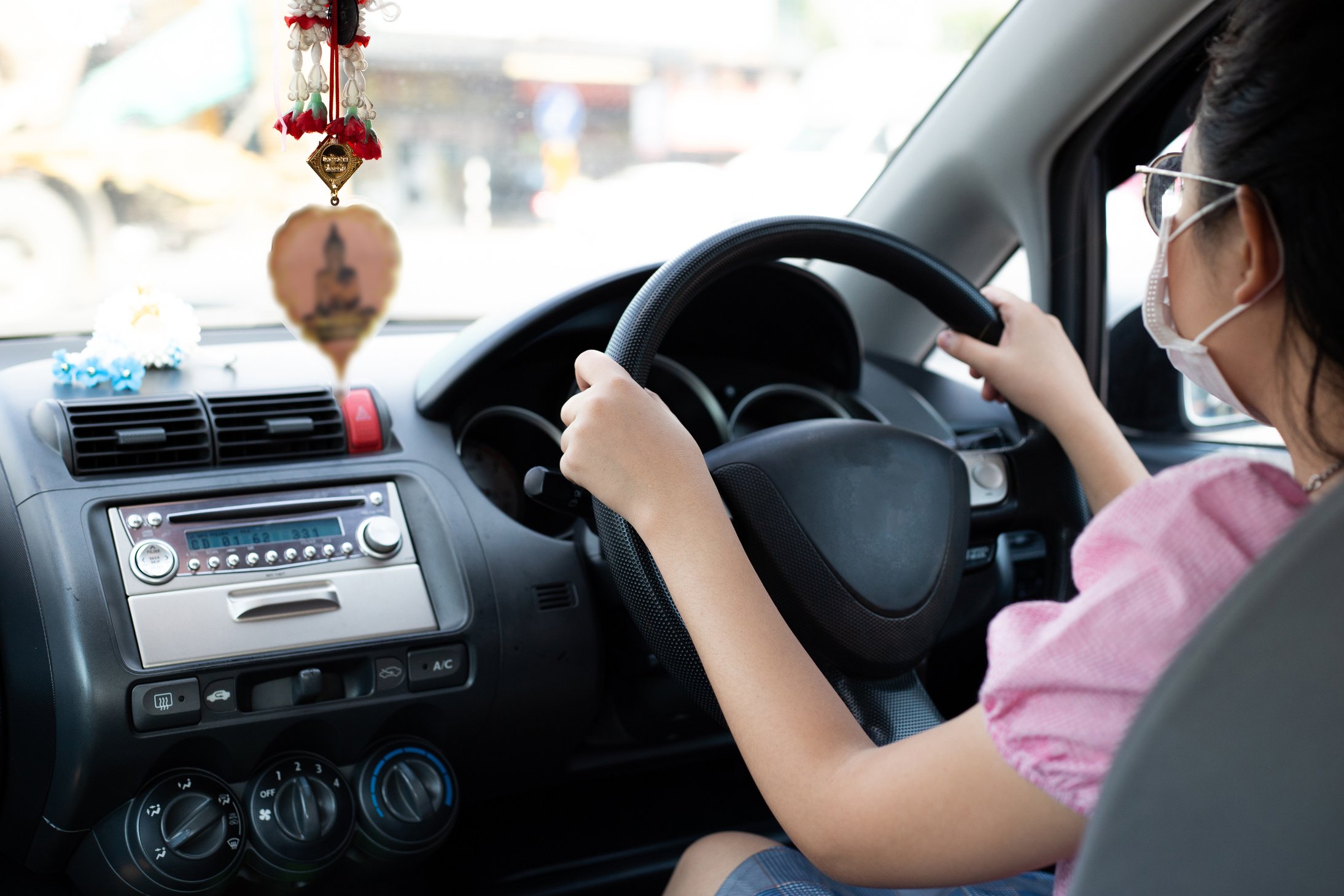 Woman Driving a Car